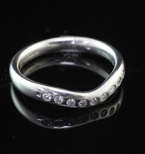 A Tiffany & Co platinum and nine stone diamond set herringbone shaped ring, size L.